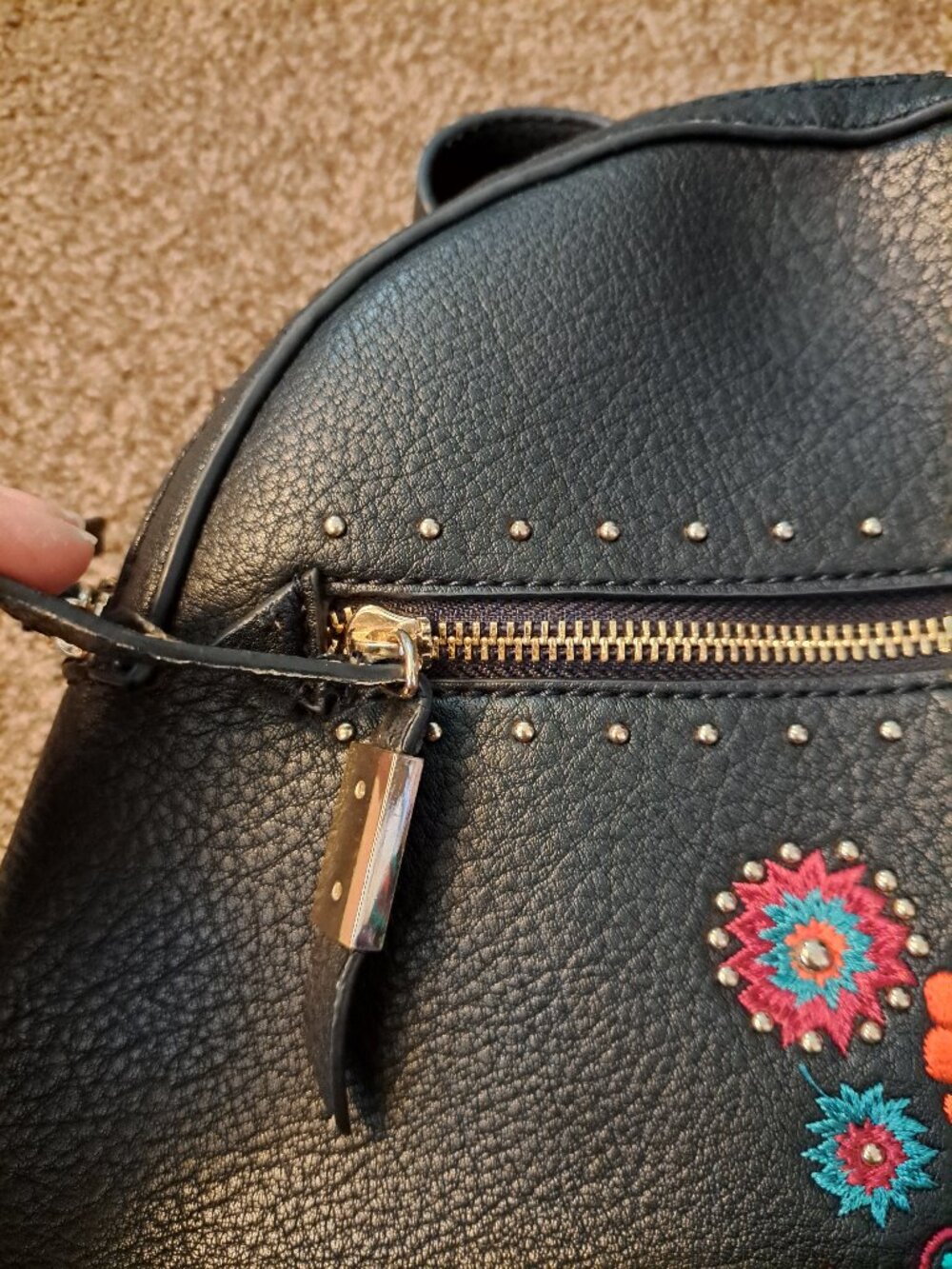Black Steve Madden embroidered floral backpack with gold hardware. - Picture 12 of 13